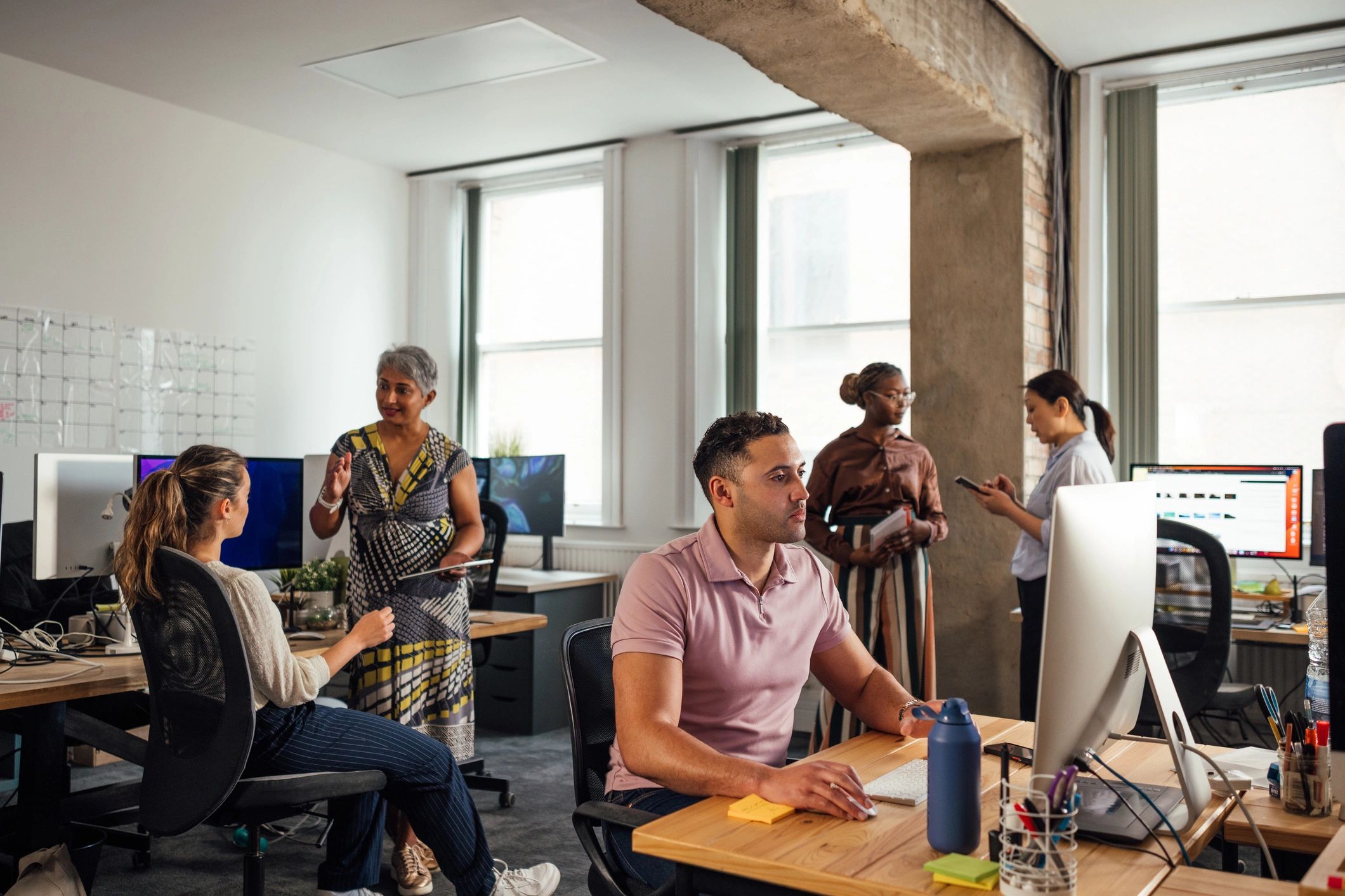Technology consulting team working together in an office