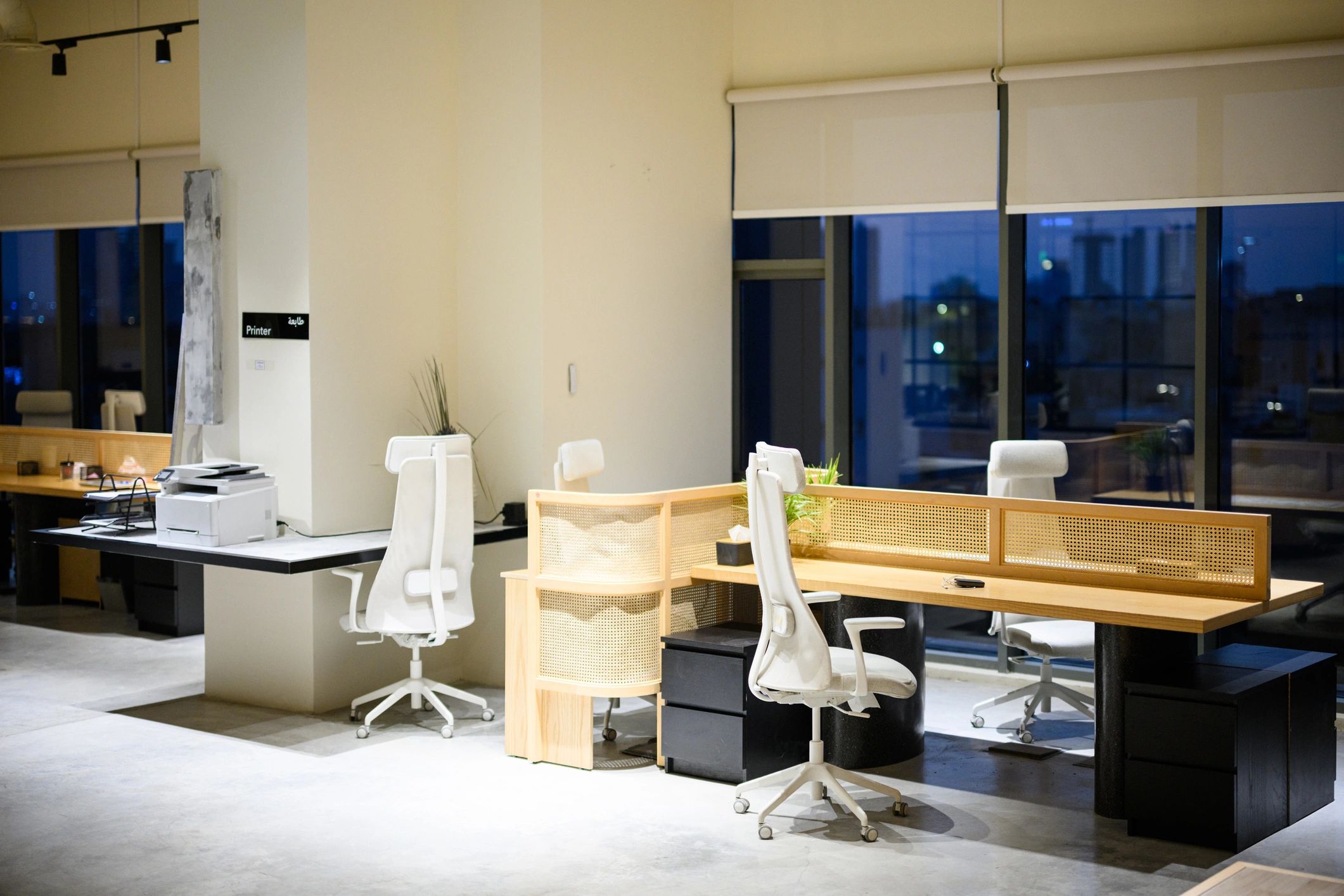 Modern technology office interior with desks and city view