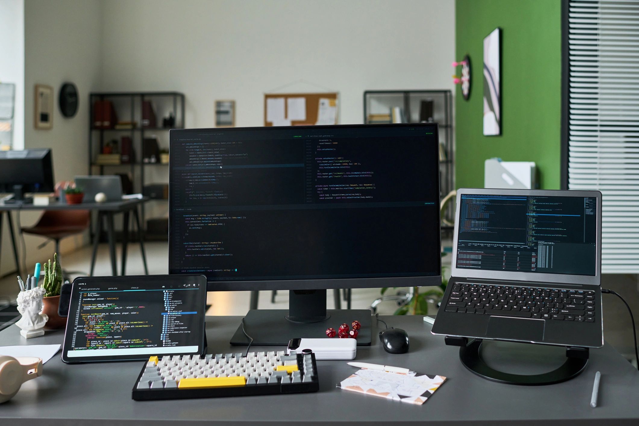 Technology workspace with code and monitoring screens